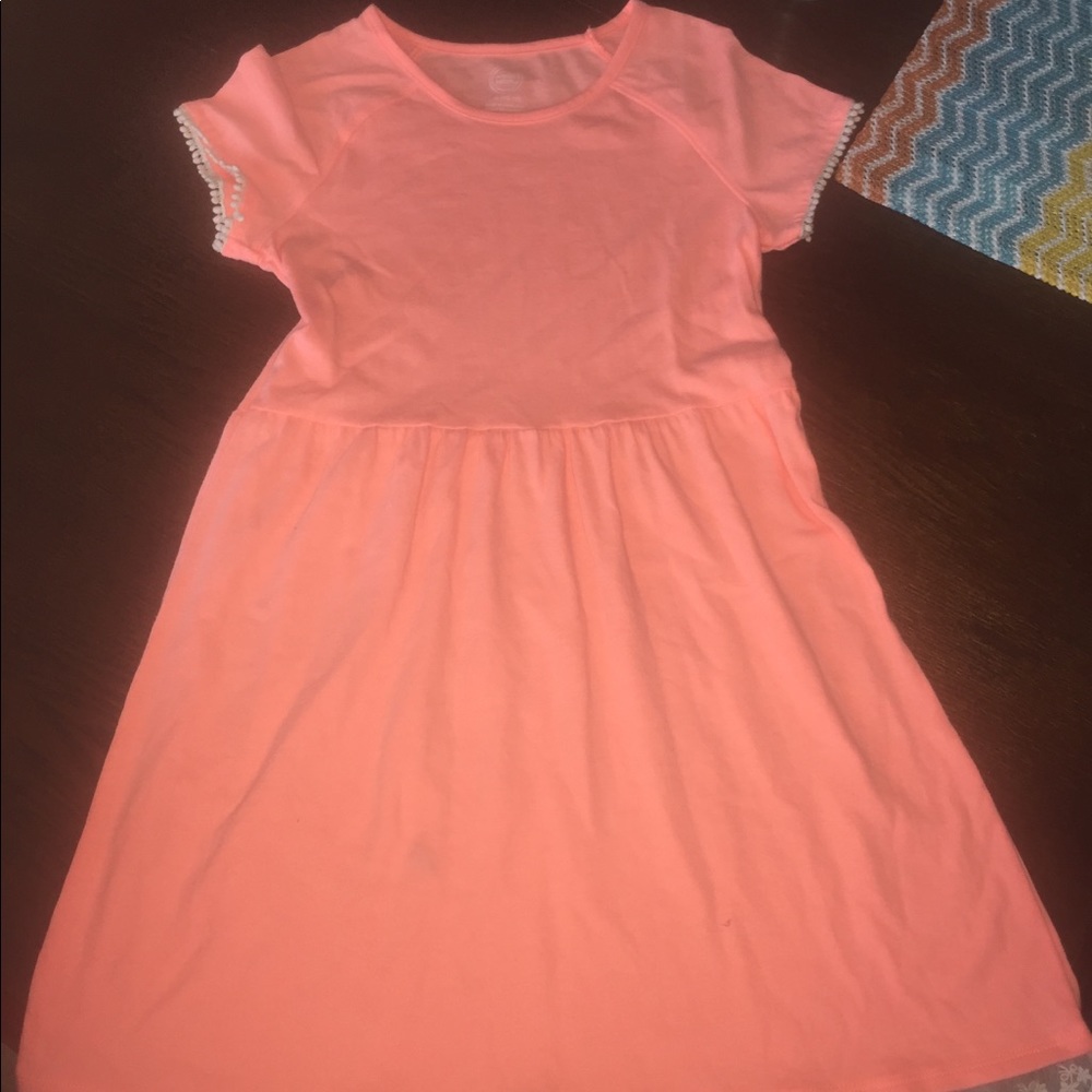 Two dresses. Never worn. Size 10-12